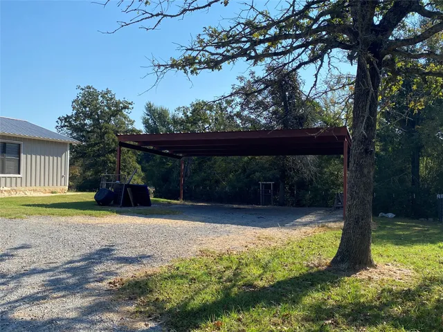 a view of a backyard with a small cabin
