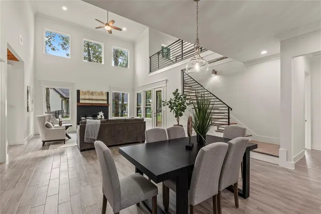 a view of livingroom and dining room with furniture wooden floor and a chandelier
