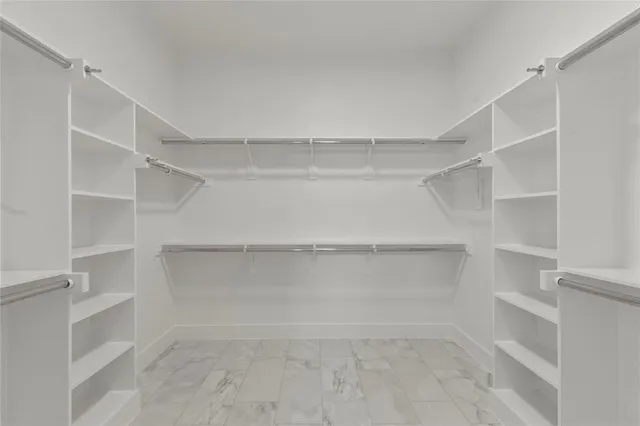 a view of an empty walk in closet