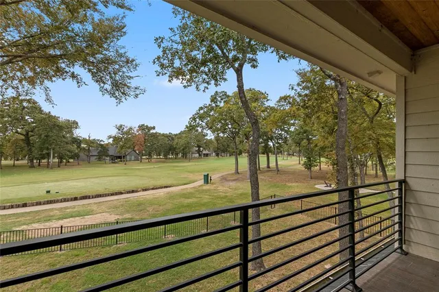 a view of a yard next to a lake