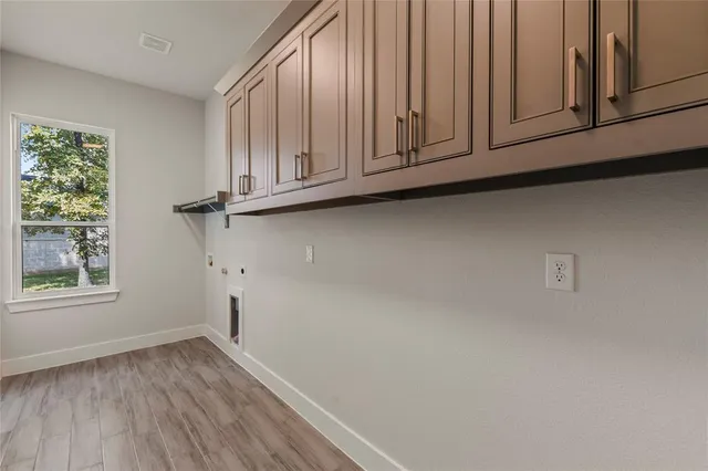 a view of front door with wooden floor
