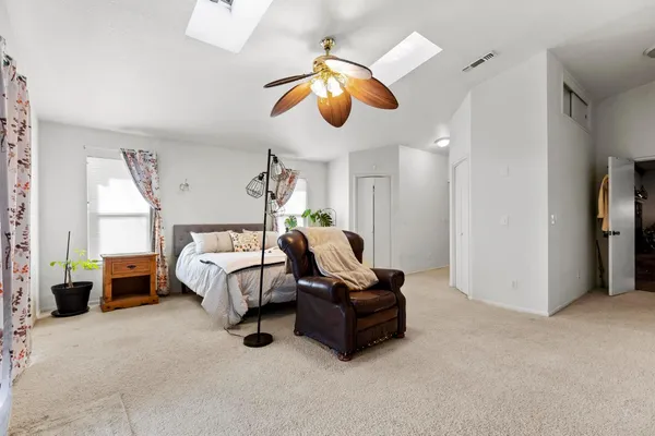 a bedroom with bed and furniture