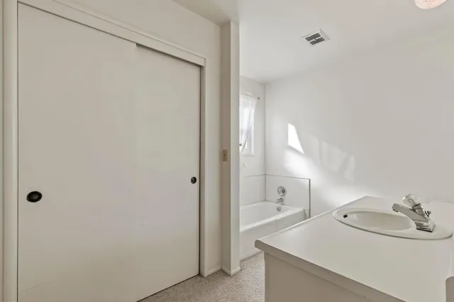 a bathroom with a sink and mirror