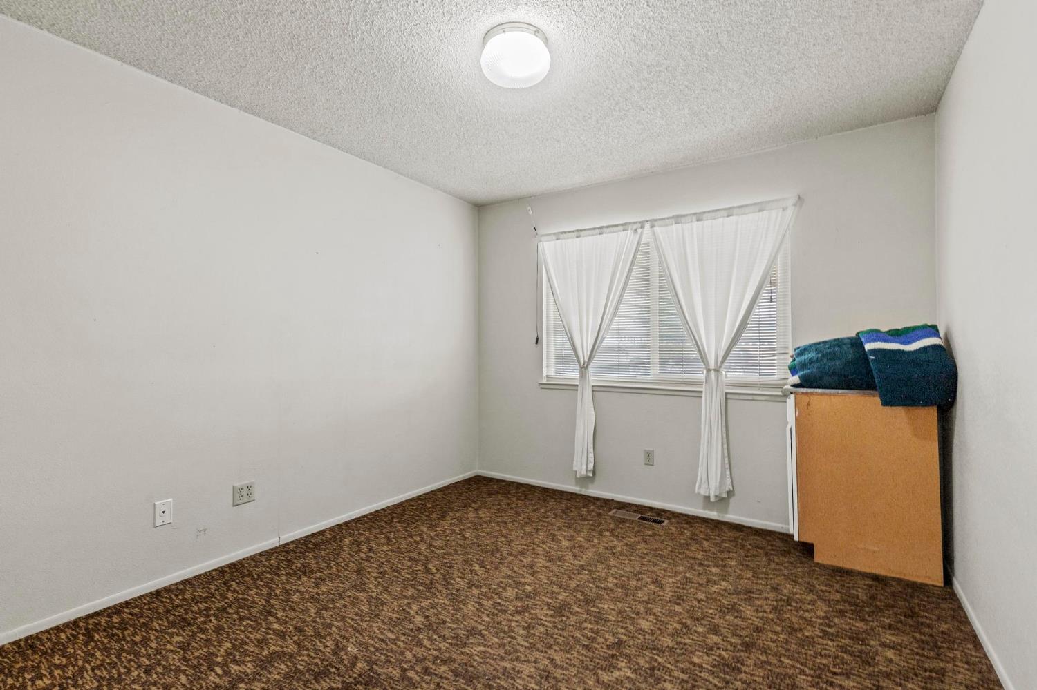 225 Elm Street Maxwell, CA 95955 - Photo 26 of 50 a view of storage and utility room with a window