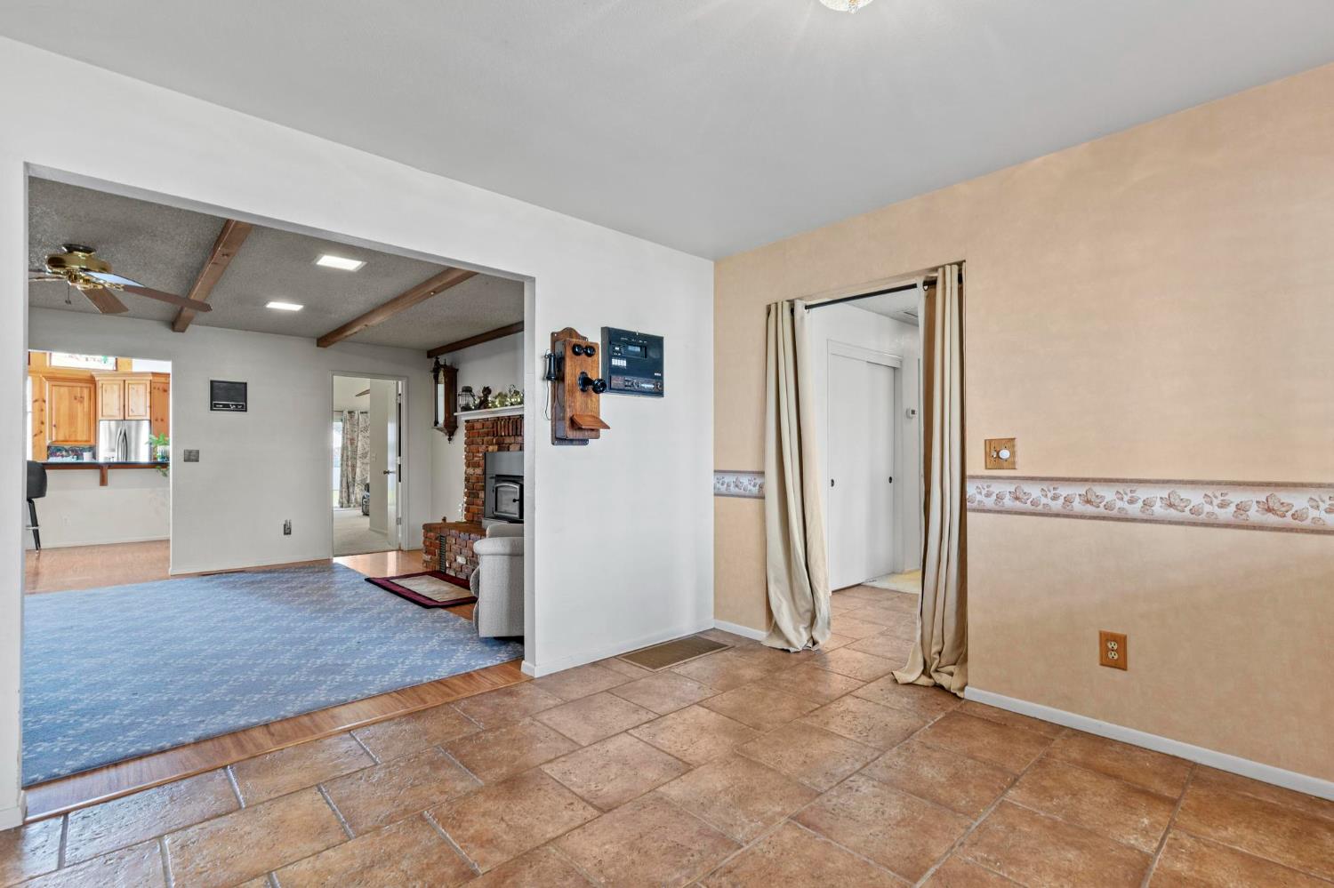 225 Elm Street Maxwell, CA 95955 - Photo 35 of 50 a view of a livingroom with wooden floor and kitchen space
