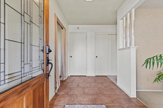 a view of a hallway with a dining area