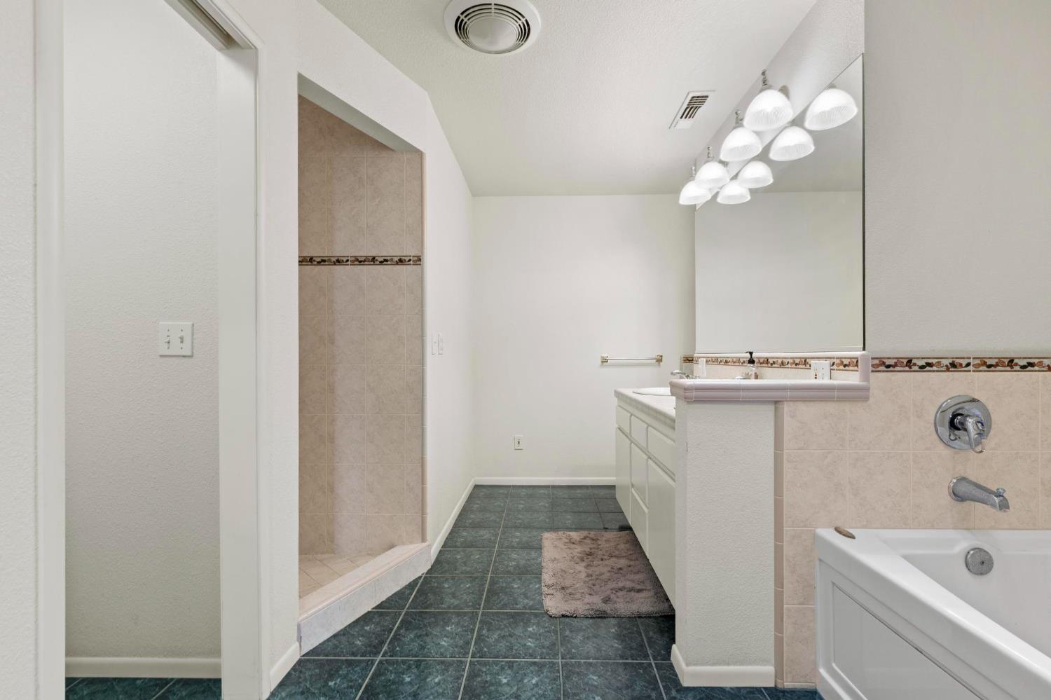 225 Elm Street Maxwell, CA 95955 - Photo 9 of 50 a bathroom with a sink a toilet and shower