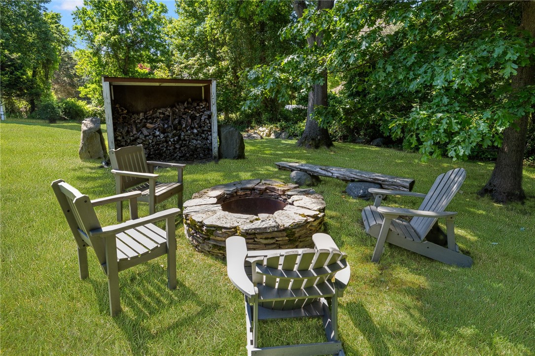 621 East Shore Road Jamestown, RI 02835 - Photo 45 of 50 Stone fire pit with wood storage shed is a great spot to relax!