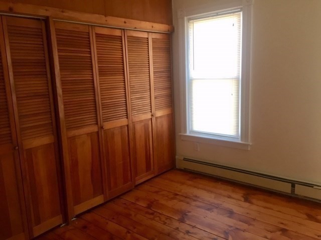 51 May Street Worcester, MA 01610 - Photo 11 of 23 a view of a small space with wooden floor and a window