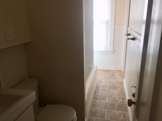 51 May Street Worcester, MA 01610 - Photo 12 of 23 a bathroom with a toilet and a shower