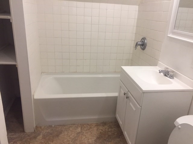 51 May Street Worcester, MA 01610 - Photo 21 of 23 a bathroom with a sink a toilet and shower