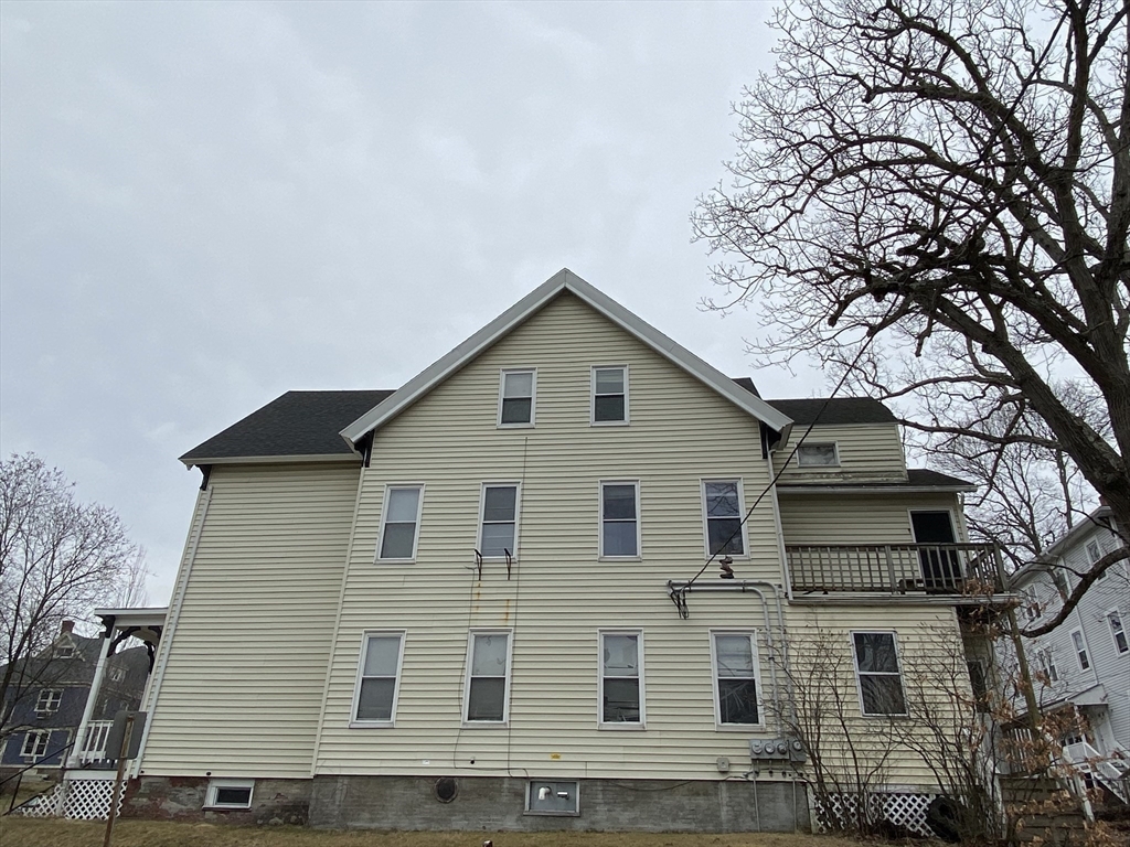 51 May Street Worcester, MA 01610 - Photo 3 of 23 a front view of a house with a yard