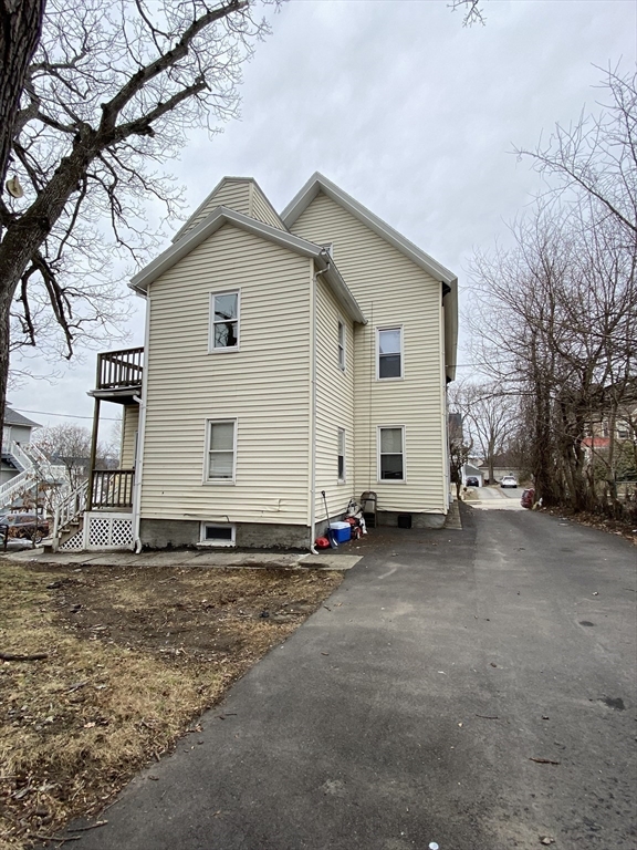 51 May Street Worcester, MA 01610 - Photo 5 of 23 a view of a house with a yard