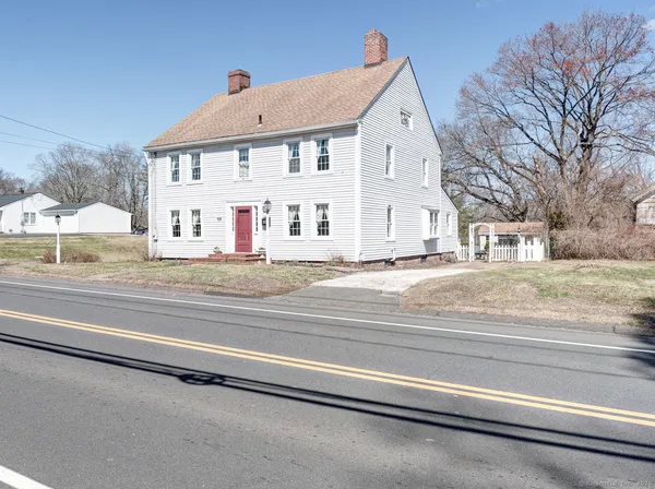 a view of a house with a street