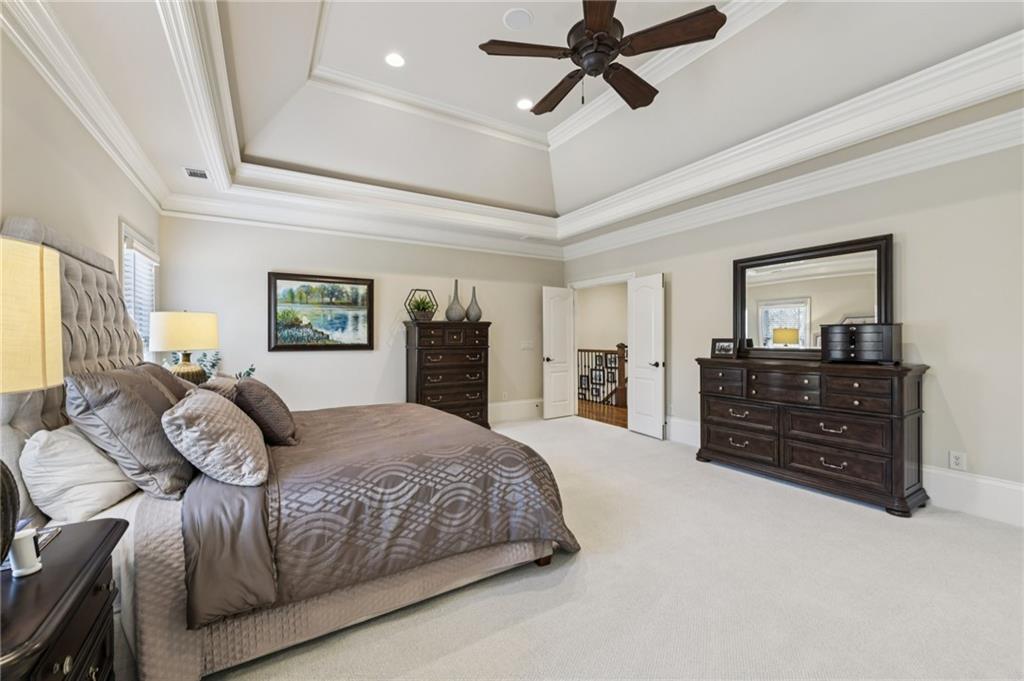 2071 Trimleston Road Statham, GA 30666 - Photo 40 of 96 a bedroom with a bed and dresser with mirror