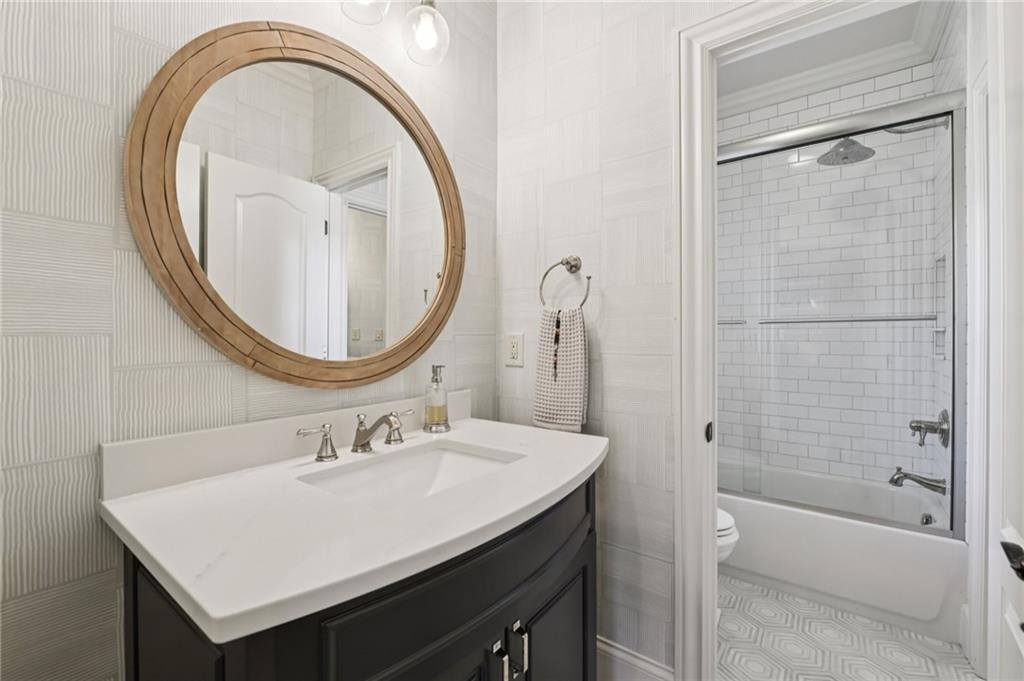 2071 Trimleston Road Statham, GA 30666 - Photo 57 of 96 a bathroom with a sink a toilet and a mirror