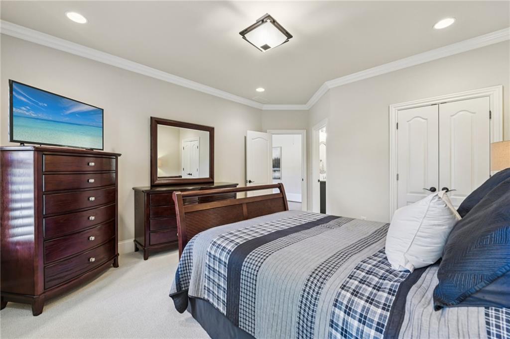 2071 Trimleston Road Statham, GA 30666 - Photo 58 of 96 a bedroom with a bed and a dresser