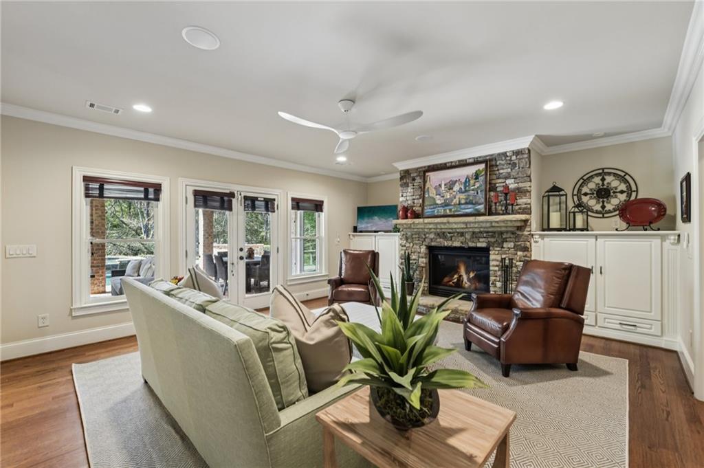 2071 Trimleston Road Statham, GA 30666 - Photo 61 of 96 a living room with furniture a fireplace and a potted plant