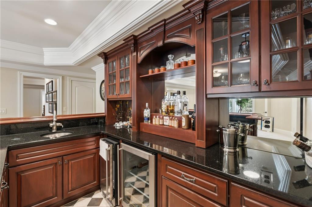 2071 Trimleston Road Statham, GA 30666 - Photo 64 of 96 a kitchen with stainless steel appliances granite countertop a sink and wooden cabinets
