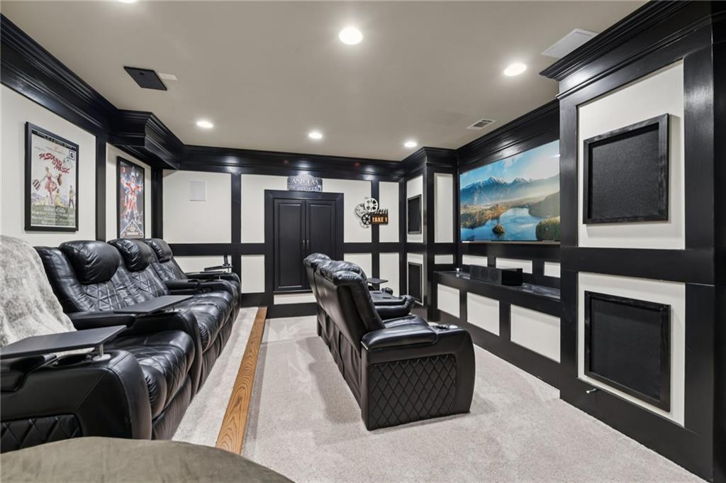 2071 Trimleston Road Statham, GA 30666 - Photo 71 of 96 a living room with furniture a floor to ceiling window and flat screen tv