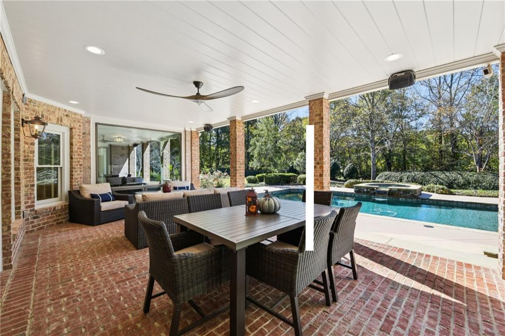 2071 Trimleston Road Statham, GA 30666 - Photo 79 of 96 a dining room with furniture a large window and a rug