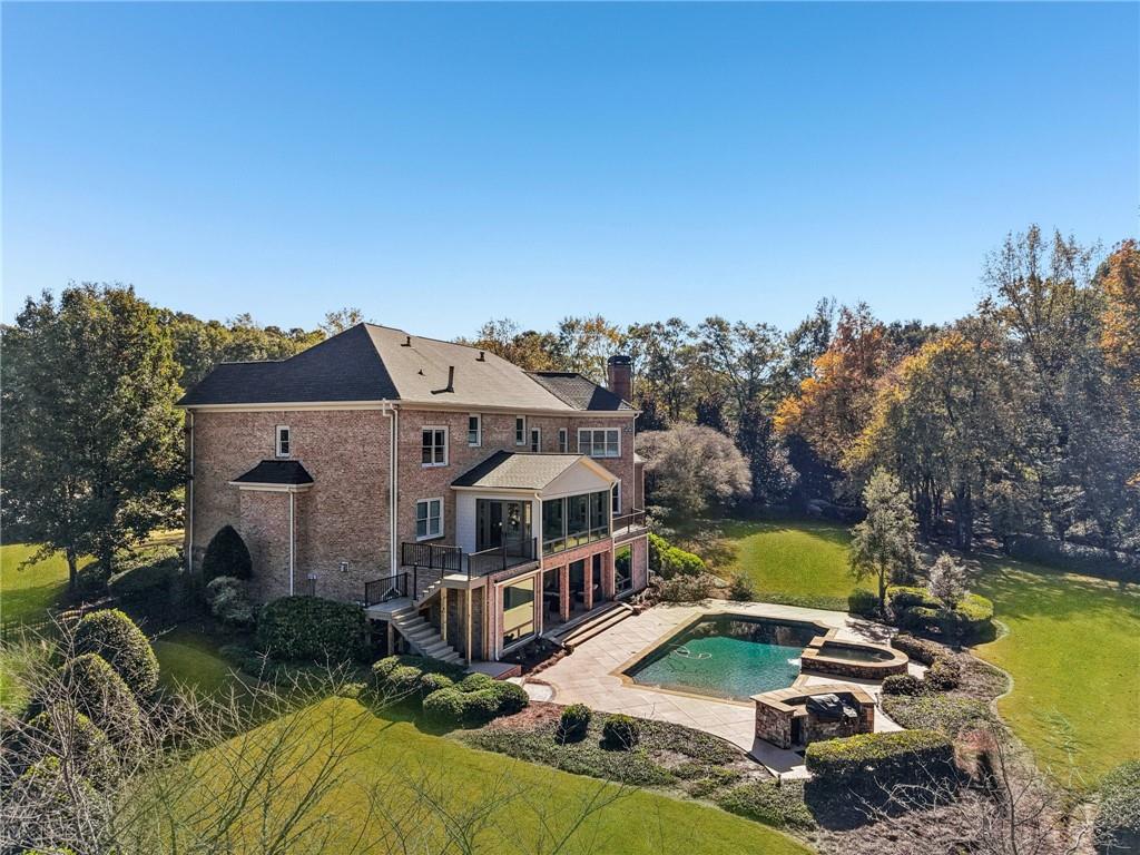 2071 Trimleston Road Statham, GA 30666 - Photo 90 of 96 an aerial view of a house with swimming pool and large trees
