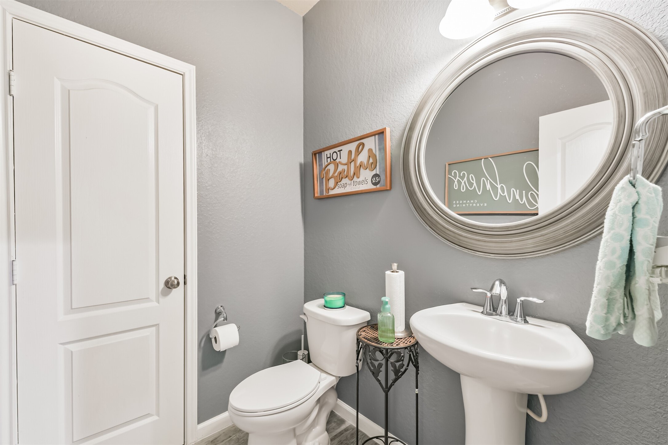 24047 Schults Meadow Lane Spring, TX 77389 - Photo 19 of 47 a bathroom with a toilet a sink and a mirror