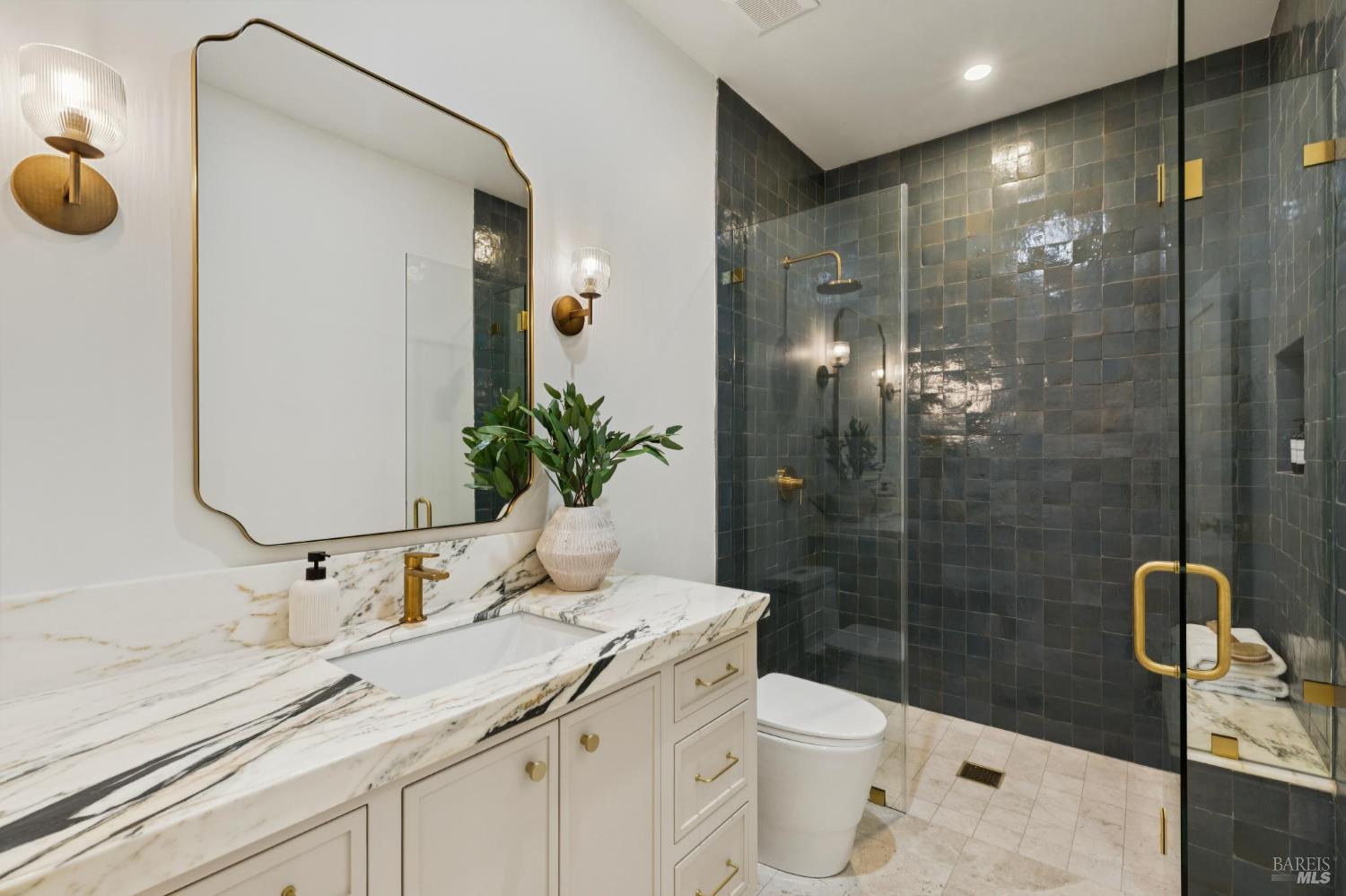 1860 McKinley Road Napa, CA 94558 - Photo 73 of 89 a bathroom with a granite countertop sink a toilet and shower