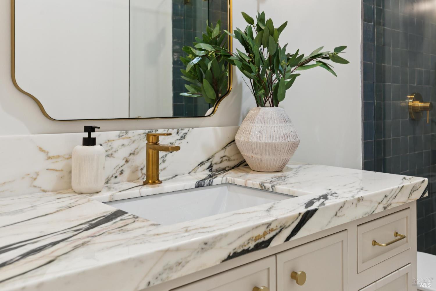 1860 McKinley Road Napa, CA 94558 - Photo 74 of 89 a bathroom with a granite countertop sink a mirror and a potted plant