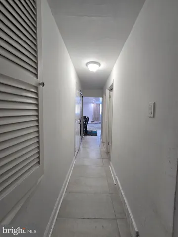 a view of hallway with a couch