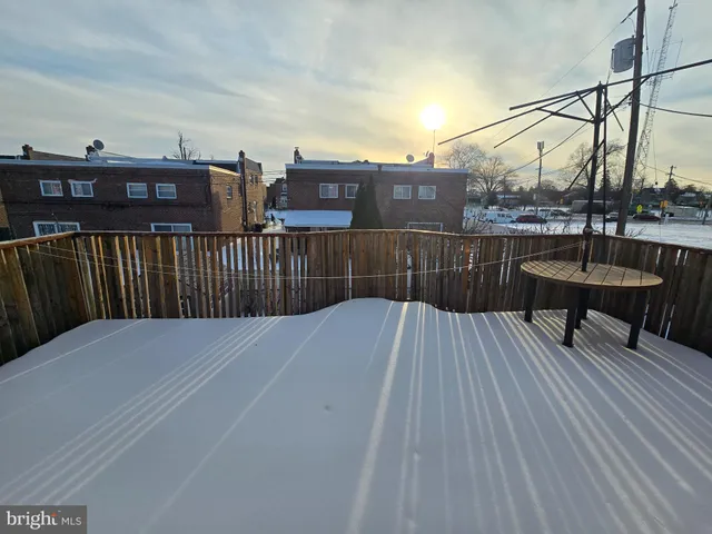 a view of a balcony with two chairs and a table