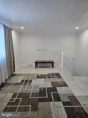 a view of a hall with wooden floor