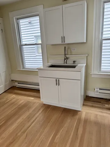 a kitchen with a sink and cabinets