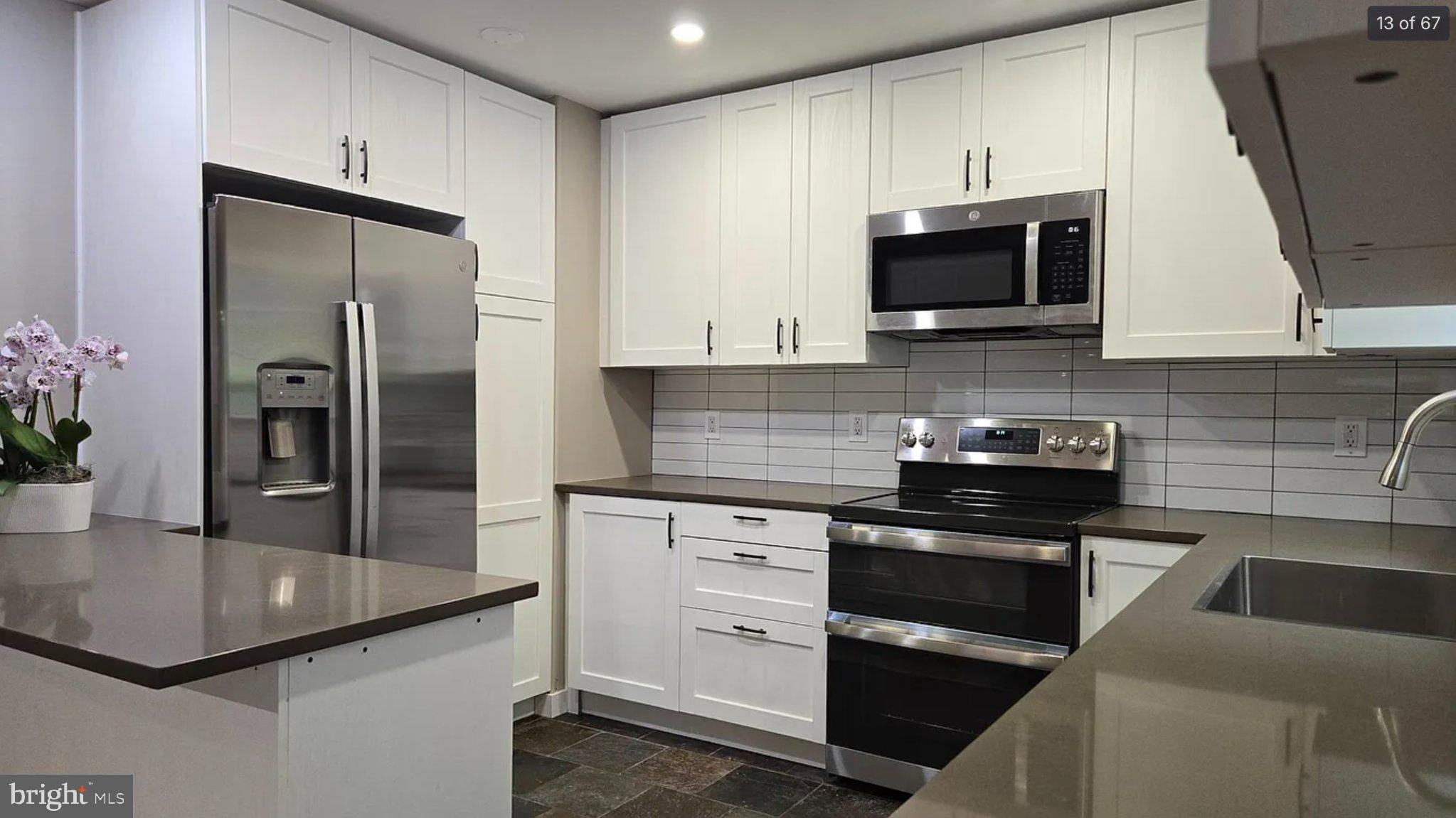 3906 Valley Ridge Drive Fairfax, VA 22033 - Photo 13 of 58 Modern kitchen with sleek finishes.