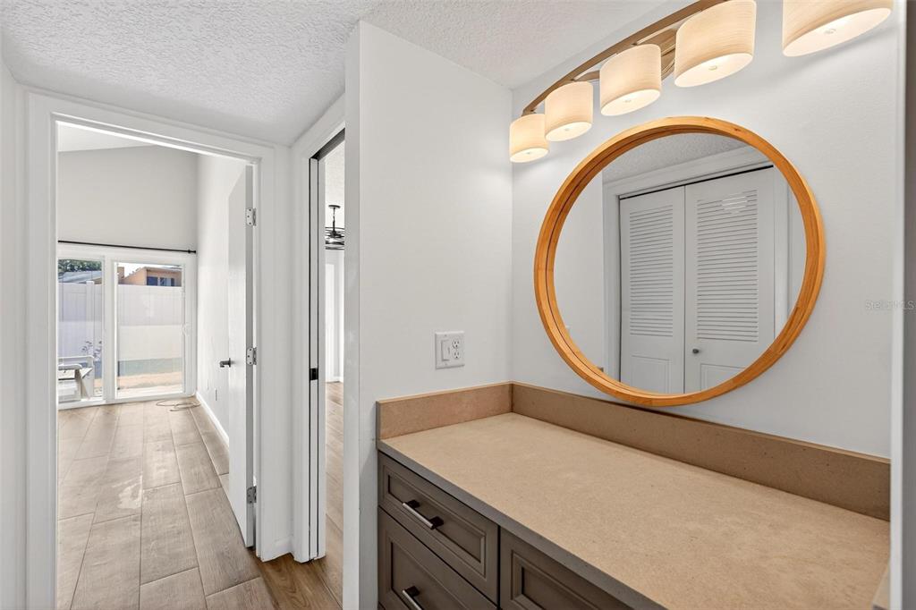 1051 South Highland Street, Unit A Mount Dora, FL 32757 - Photo 25 of 46 a bathroom with a sink and a mirror
