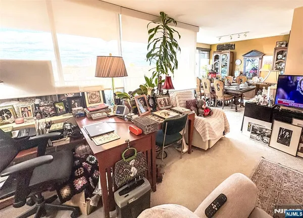 a view of a livingroom with furniture and entryway