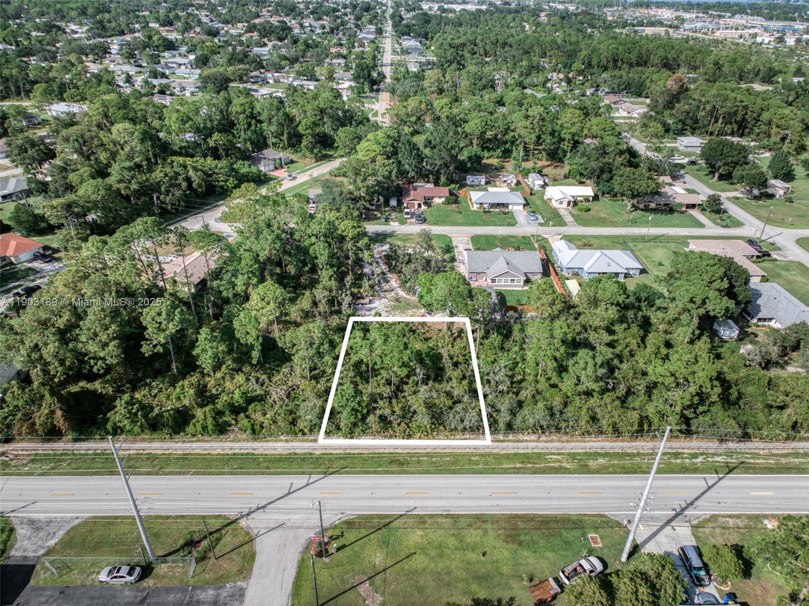 3308 Thunderbird Road Sebring, FL 33872 - Photo 1 of 5 an aerial view of residential house with outdoor space and trees all around