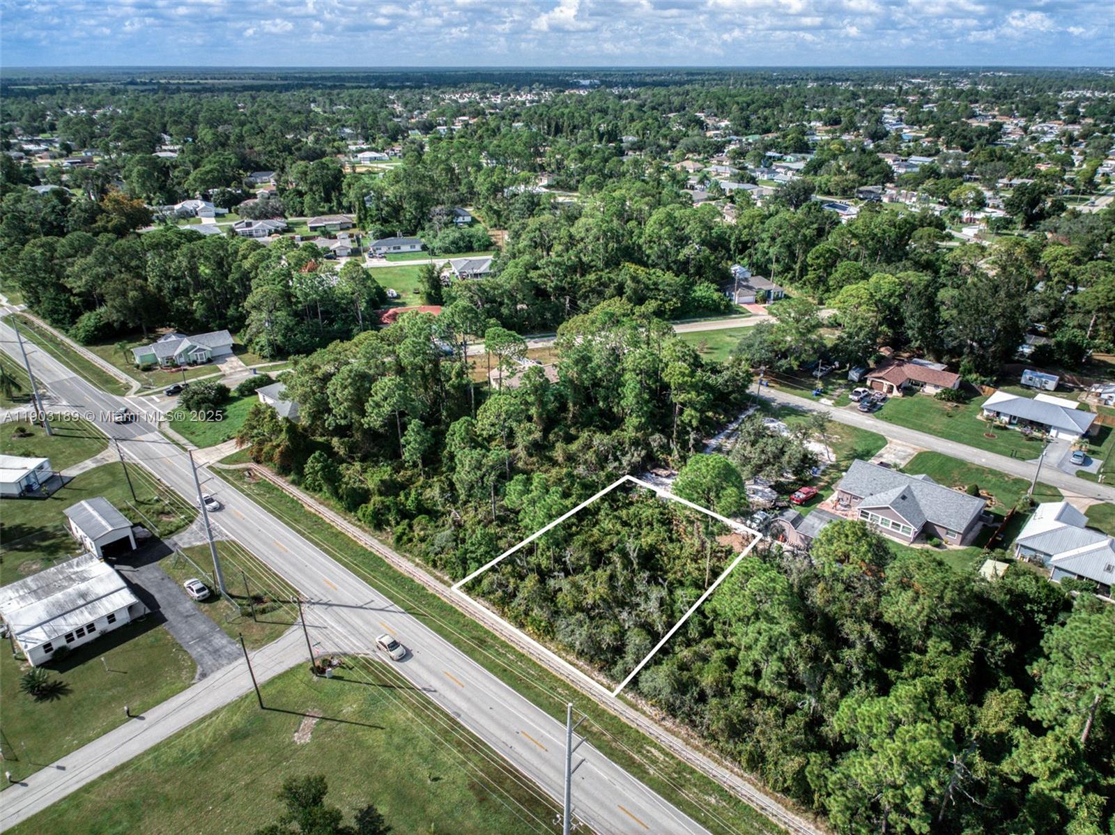 3308 Thunderbird Road Sebring, FL 33872 - Photo 3 of 5 an aerial view of residential houses with outdoor space and trees