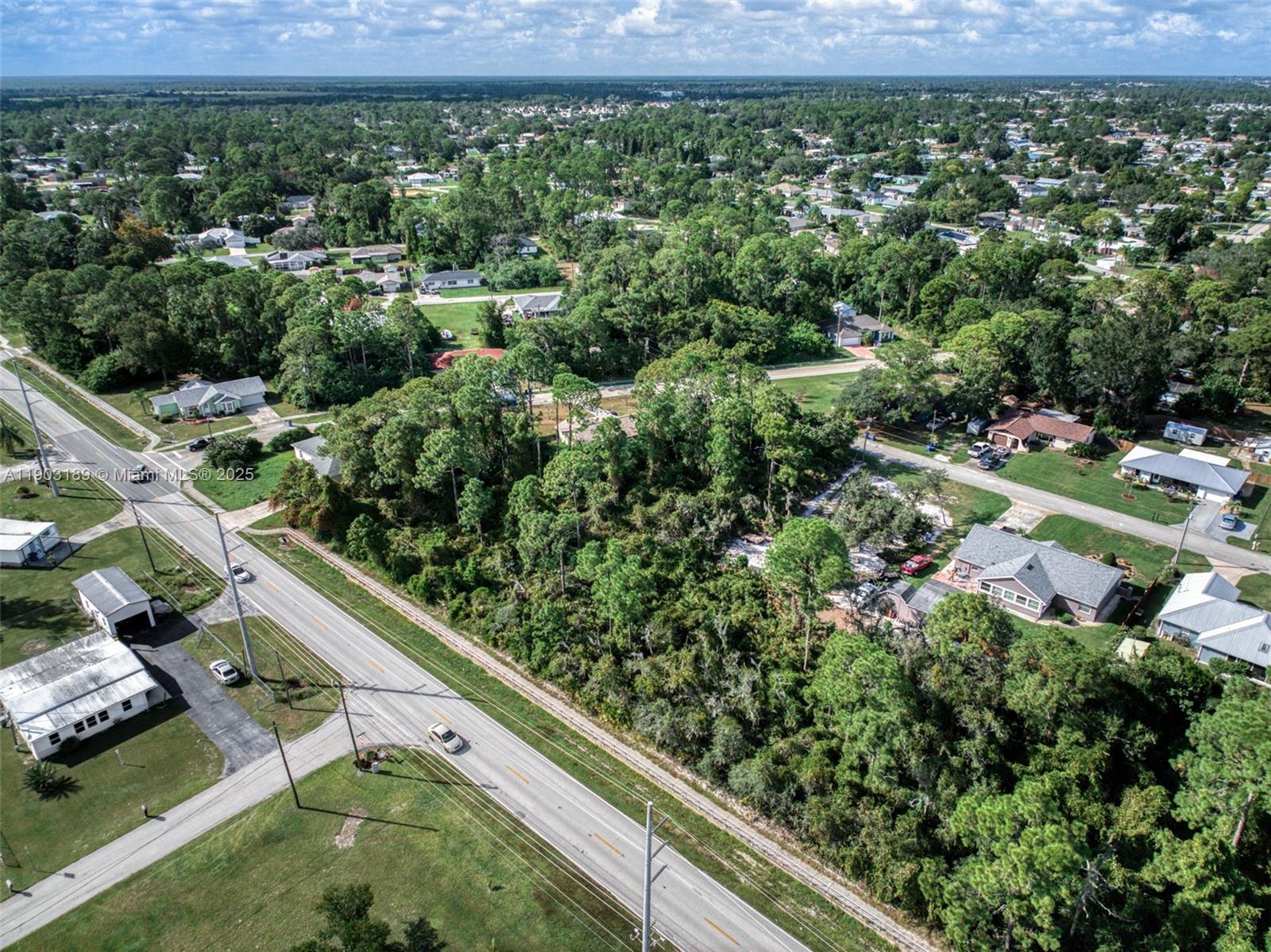 3308 Thunderbird Road Sebring, FL 33872 - Photo 4 of 5 an aerial view of residential houses with outdoor space and trees
