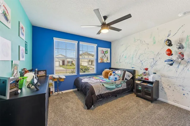 a view of a patio with a table chairs and a backyard
