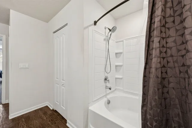 a kitchen with kitchen island granite countertop a sink stove and cabinets