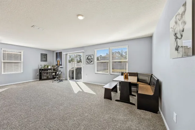 a kitchen with stainless steel appliances granite countertop a refrigerator a stove and a sink