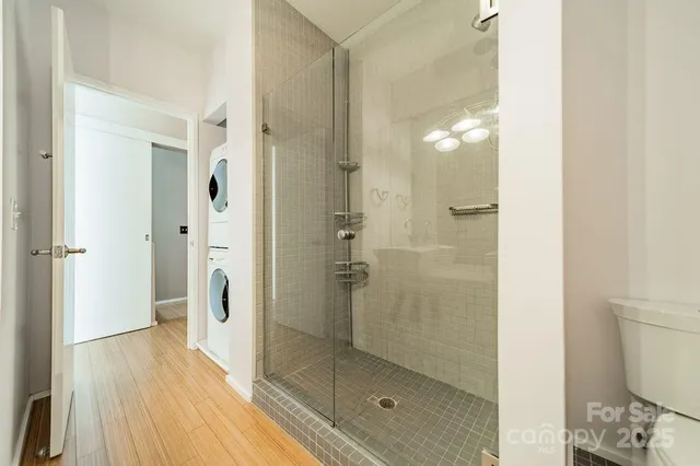 a bathroom with a glass shower door