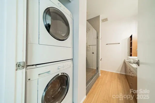 a view of a hallway with washer and dryer