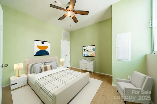 a bedroom with a bed and a couch