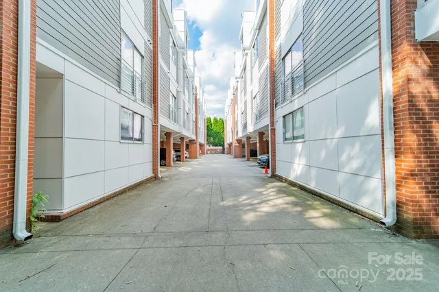a view of a parking space in front of a building