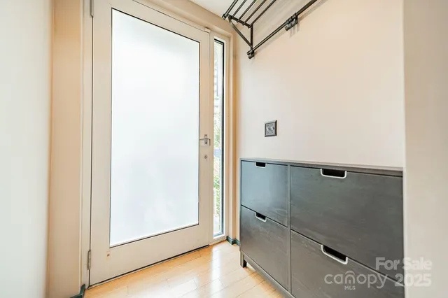 a bathroom with a glass shower door