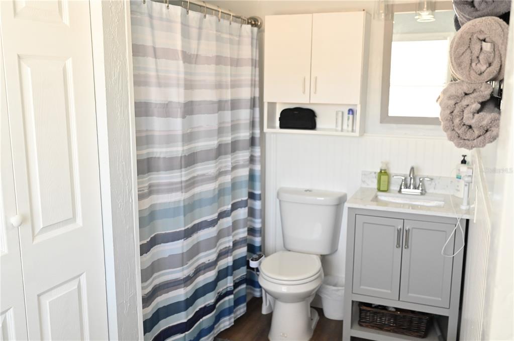 15024 Northwest 89th Street Alachua, FL 32615 - Photo 11 of 16 a white toilet sitting next to a bathroom sink