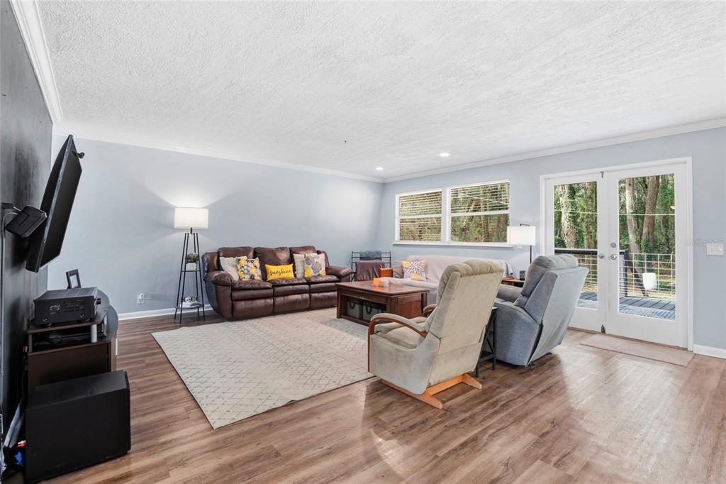 15024 Northwest 89th Street Alachua, FL 32615 - Photo 12 of 31 a living room with furniture and a flat screen tv