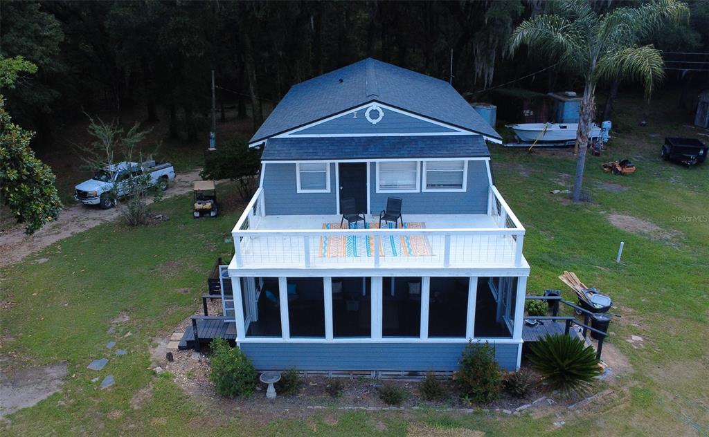 15024 Northwest 89th Street Alachua, FL 32615 - Photo 2 of 16 a front view of a house with garden